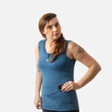 woman wearing cobalt blue tank top with 9 pockets. Taking large phone out of large pocket
